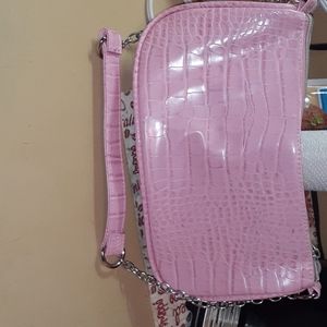 Pink purse, it fun and colorful.